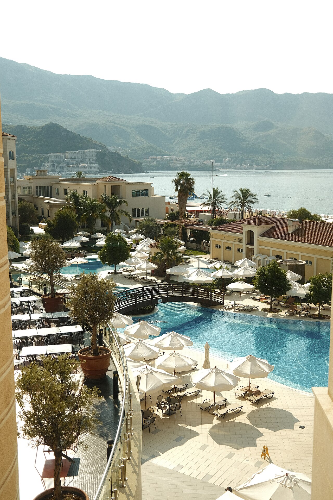 Poolside sun loungers at a Mediterranean beach resort.